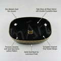 Designer table top basin design in glossy black gold ceramic, oval wash basin angled side view