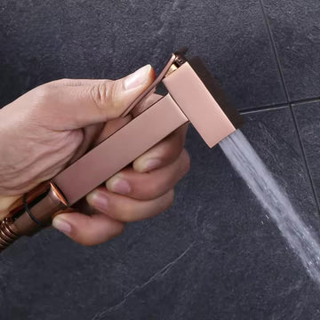 Jaquar health faucet style InArt rose gold brass jet spray with hose and holder for toilet, main view