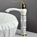 Close-up of ceramic disc cartridge single lever basin mixer tap in antique white gold finish for bathroom wash basin