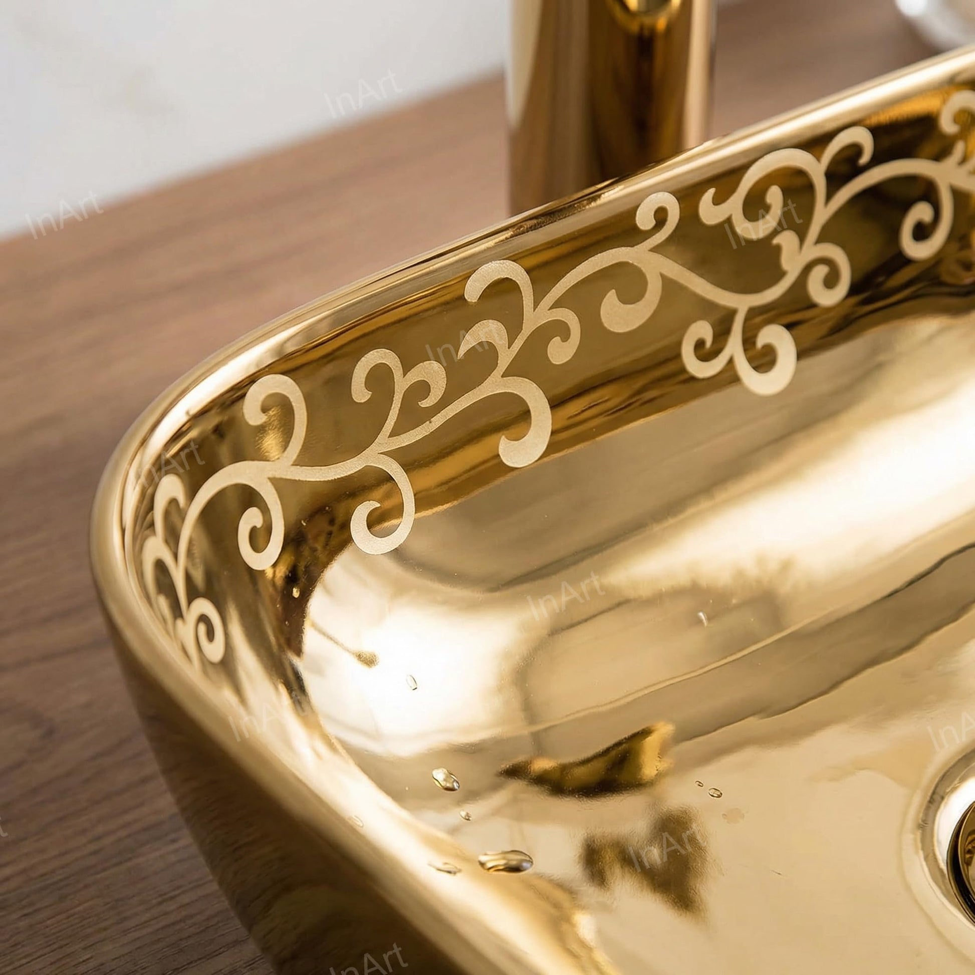 Close-up of InArt gold finish ceramic wash basin table top, smooth glazed rim and rectangular bowl detail