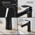 Black tap for wash basin, single lever basin mixer shown at 45 degree angle with sleek spout