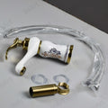 Close-up of InArt single lever basin mixer handle and ceramic cartridge, premium gold white glossy finish