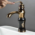 Close-up of InArt wash basin pillar cock handle and black rose gold finish, hot and cold water mixer detail