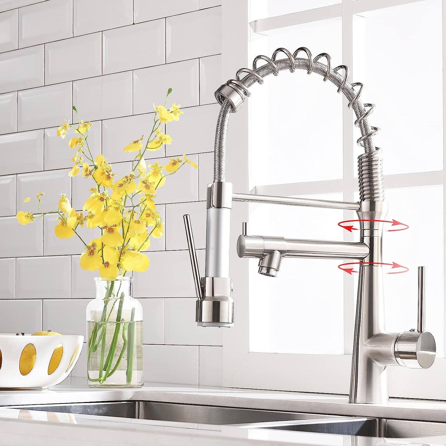 Kitchen sink mixer tap installed on countertop, pull-down sprayer for easy cleaning and rinsing