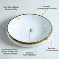 Designer counter top wash basin in glossy white with gold rim, oval ceramic, angled view