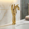 Close-up of InArt single lever wash basin mixer handle, smooth hot and cold control in golden brass
