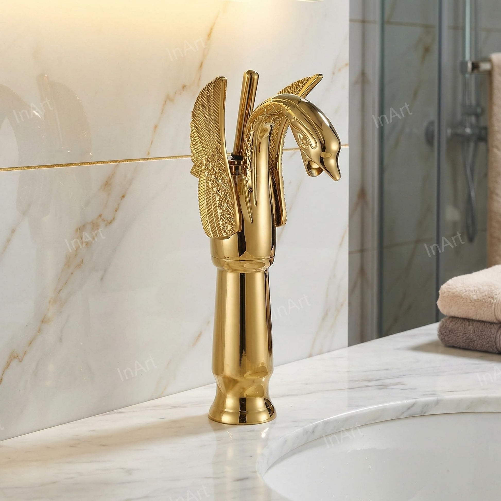 Close-up of InArt single lever wash basin mixer handle, smooth hot and cold control in golden brass