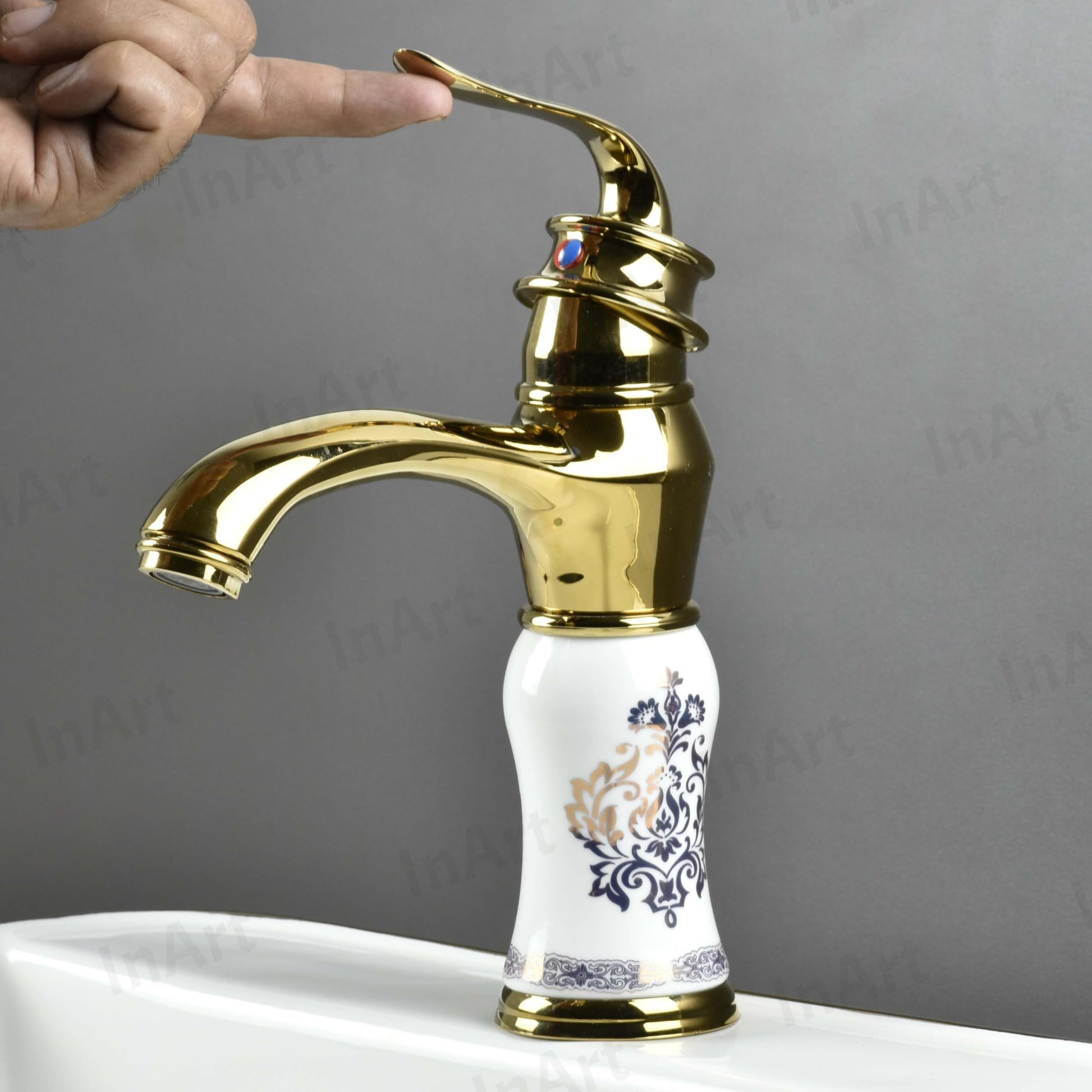 Detail of waterfall spout on InArt basin mixer tap, deck mount hot and cold water mixer for wash basin