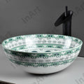 InArt designer table top basin design in light blue ceramic, round wash basin angled view
