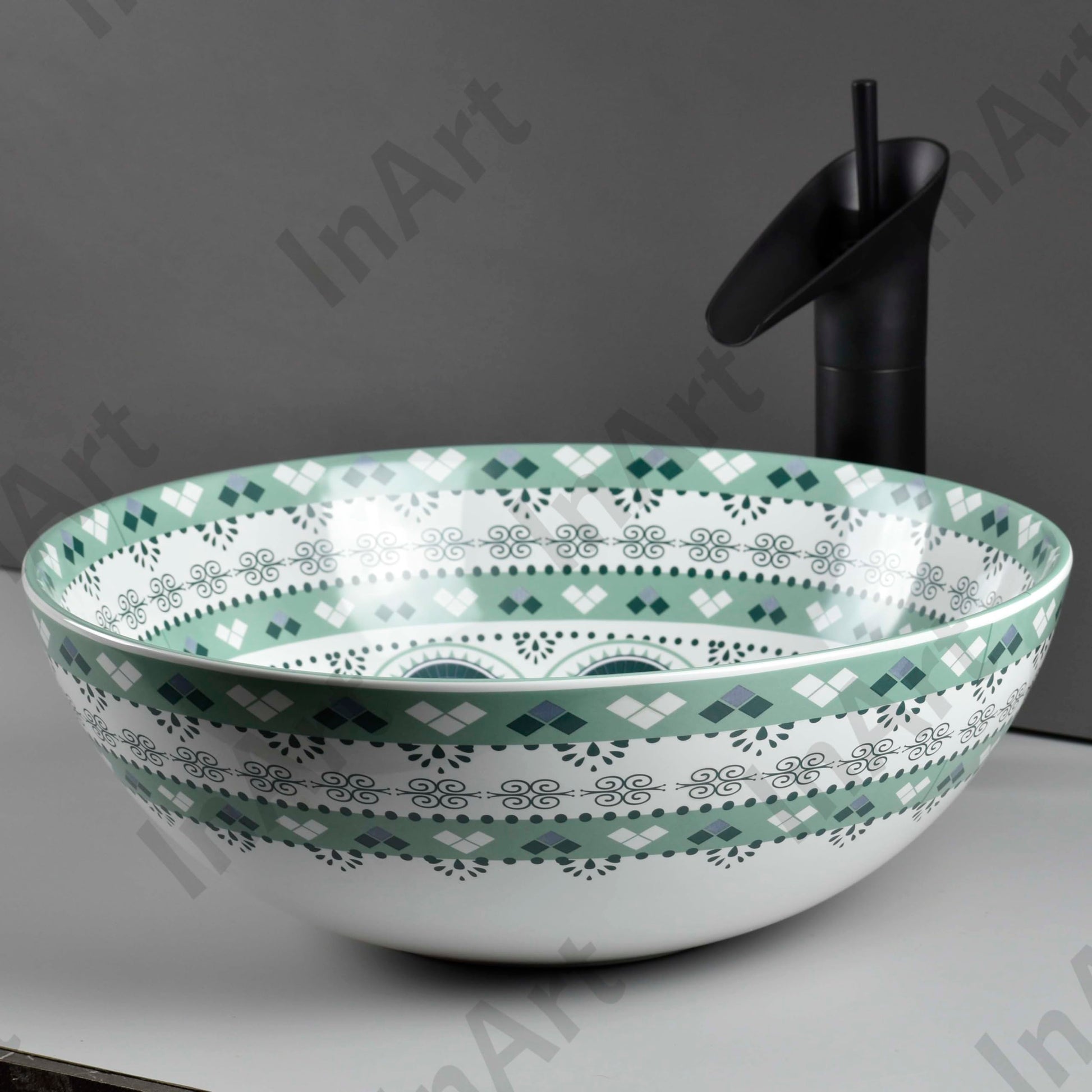 InArt designer table top basin design in light blue ceramic, round wash basin angled view