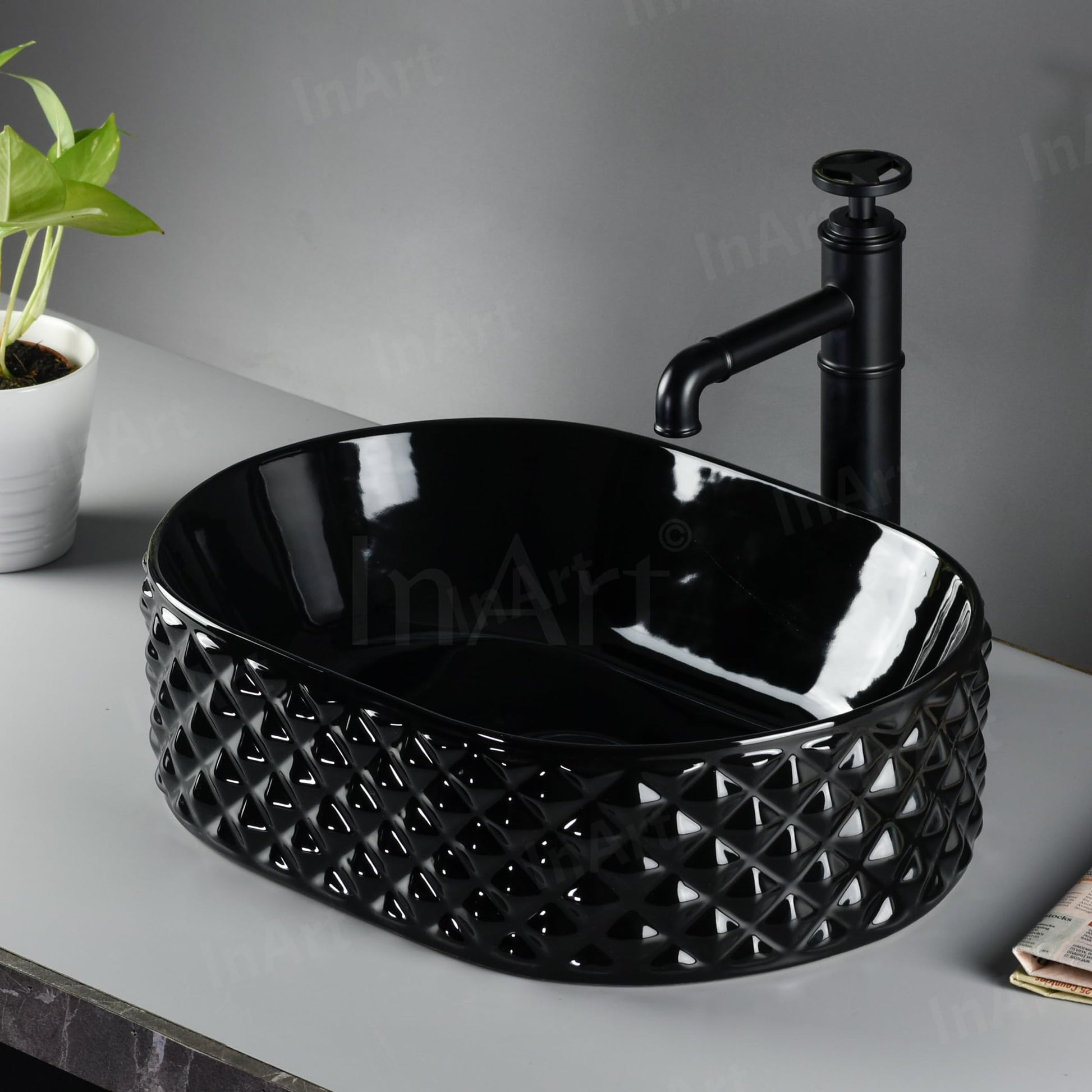 Designer black wash basin by InArt, oval table top basin ceramic with glossy finish, top view