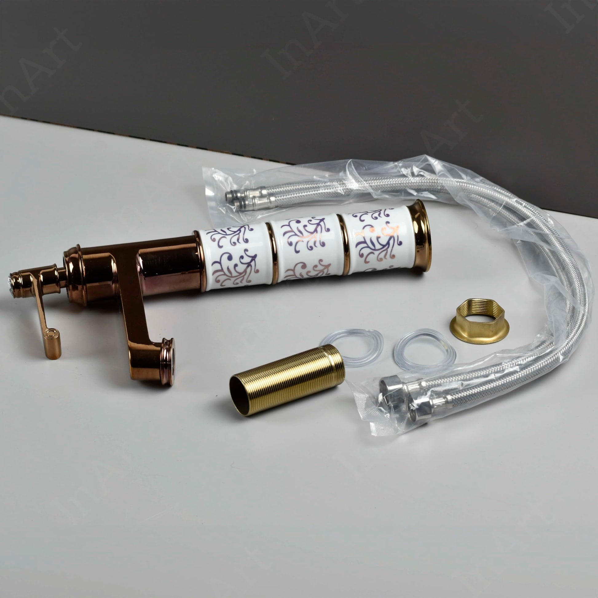 InArt single lever basin tap with waterfall spout, side angle view in antique rose gold finish for washroom