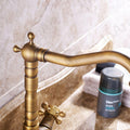 InArt vintage basin tap installed on wash basin counter, hot and cold basin mixer for bathroom interior