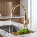 Kitchen tap with sprayer showing extended pull-down hose reach
