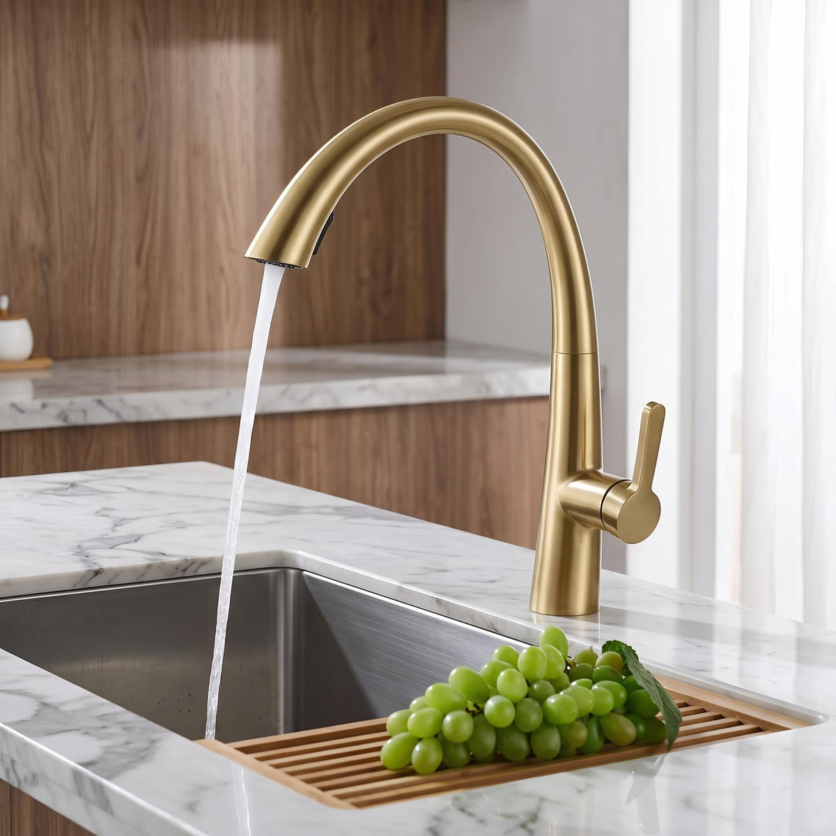 Kitchen tap with sprayer showing extended pull-down hose reach