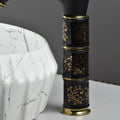Waterfall basin mixer tap black gold with ceramic disc cartridge, single lever control, close-up detail
