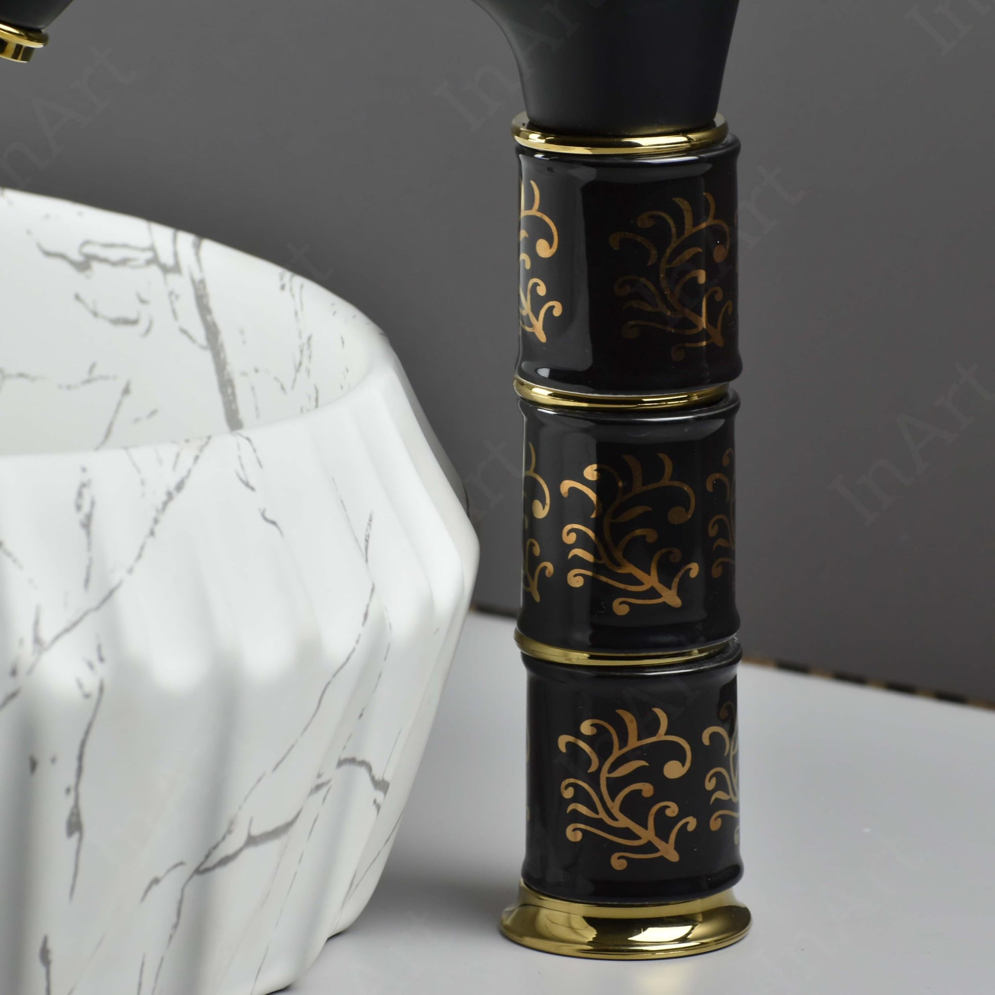 Waterfall basin mixer tap black gold with ceramic disc cartridge, single lever control, close-up detail