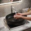 Designer oval ceramic basin in matte black for dining hand wash area