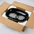 Basin table top design for dining hall wash area, oval glossy black gold ceramic wash basin lifestyle view