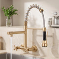 Wall mounted kitchen tap in brushed matt gold with pull-down sprayer and single lever control