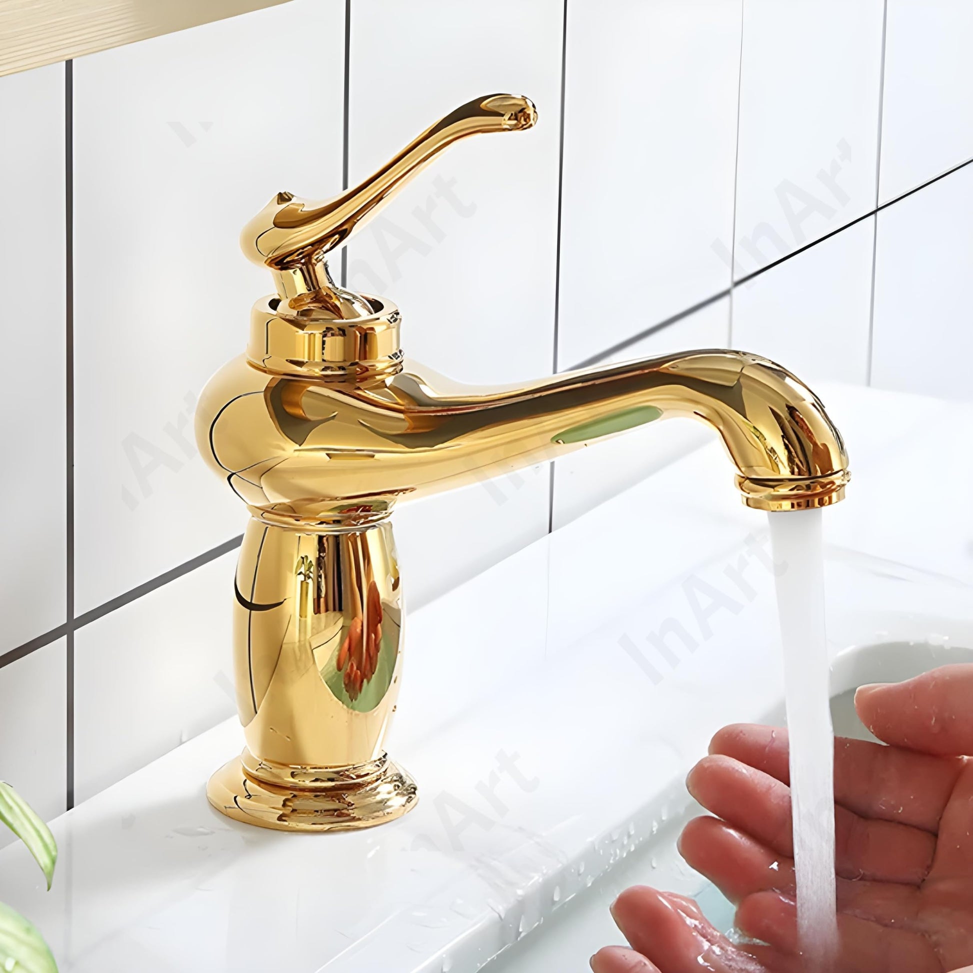 Close-up of gold finish waterfall wash basin taps showing single lever handle and brass body, InArt mixer tap