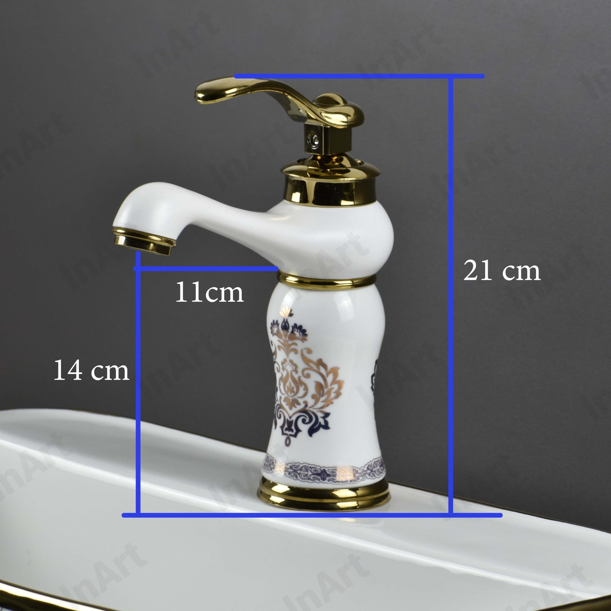 Gold white wash basin mixer tap, single lever waterfall spout, angled view for modern bathroom basin design