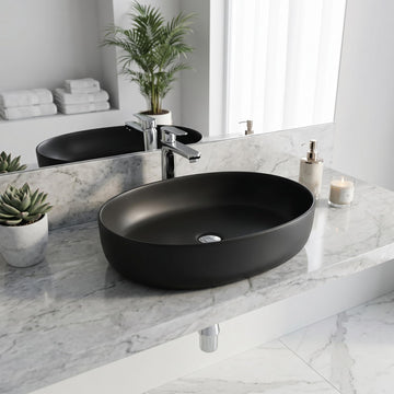 Matte black oval ceramic table top wash basin above counter view