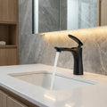 InArt bathroom tap black finish, close-up of single lever handle and brass body detailing