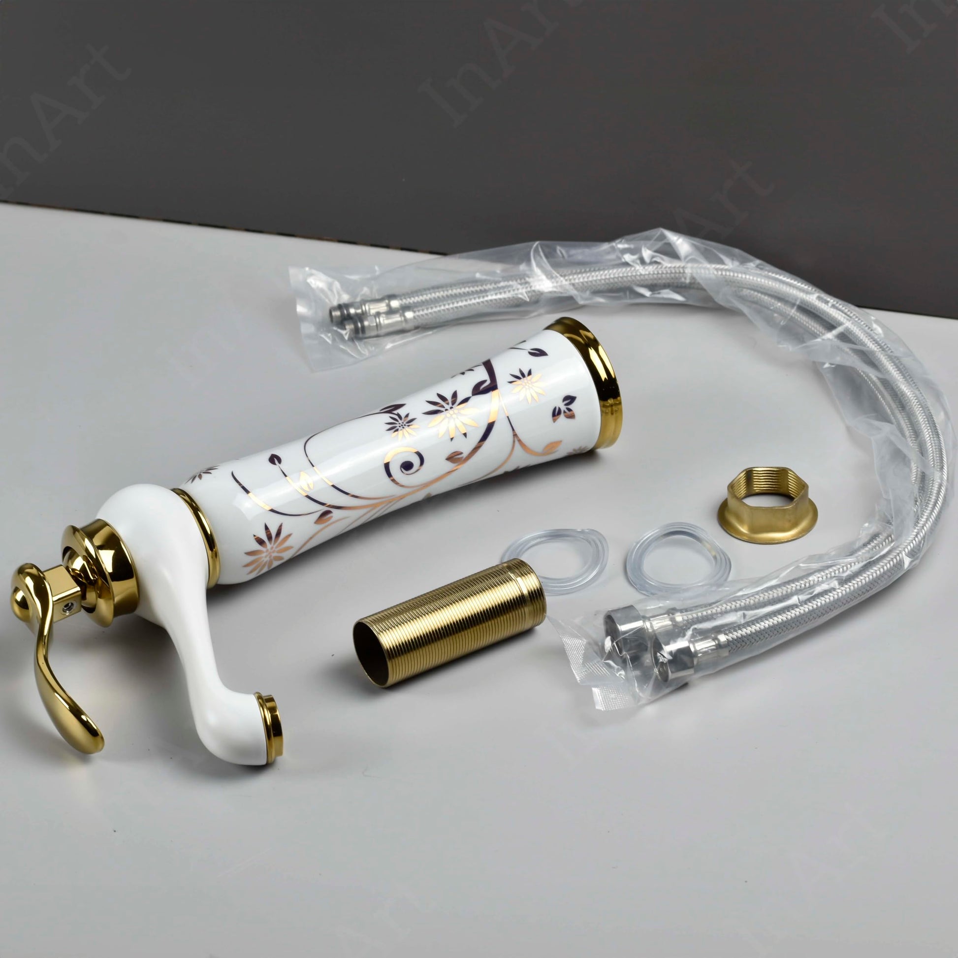 InArt waterfall wash basin tap installed in bathroom interior, premium white gold basin mixer for hot and cold water