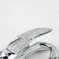 Top view of gooseneck spout and aerator on silver basin mixer, splash-free flow for washroom basin