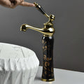 Designer waterfall wash basin taps in antique black gold, top view showing wide spout and smooth flow
