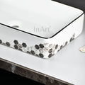 InArt vanity wash basin in ceramic, rectangular black white counter top basin, angled side view