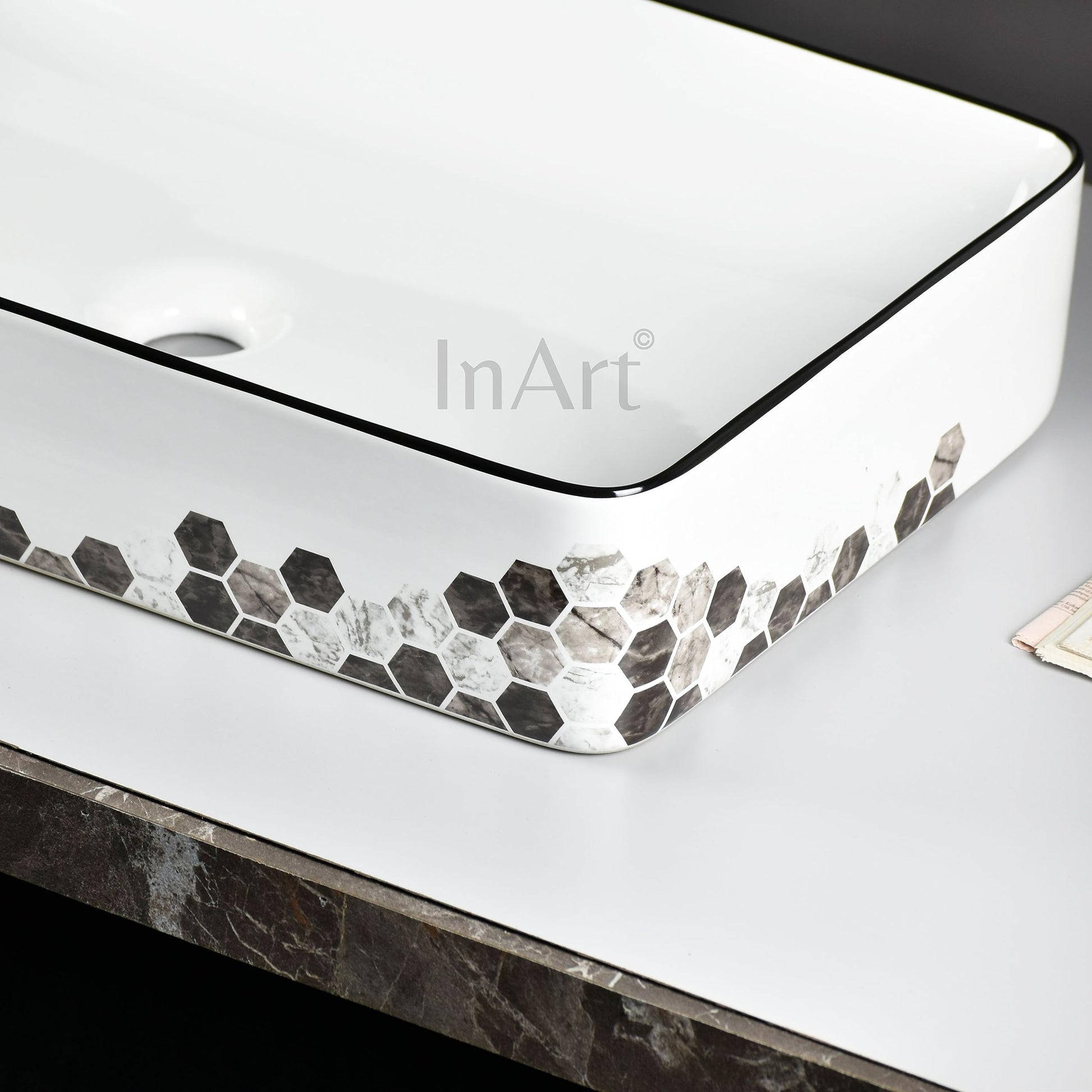 InArt vanity wash basin in ceramic, rectangular black white counter top basin, angled side view