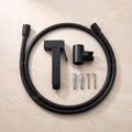 Matte black health faucet toilet jet spray set, angled view showing easy grip gun and brass body