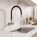 Wall mounted kitchen tap with brushed steel body and matte black flexible swing spout