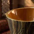 Dining room wash basin area design with wooden finish pedestal wash basin, oval ceramic basin in interior