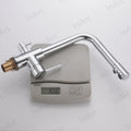 Close-up of dual lever swan neck mixer tap, smooth chrome finish on brass body for kitchen sink