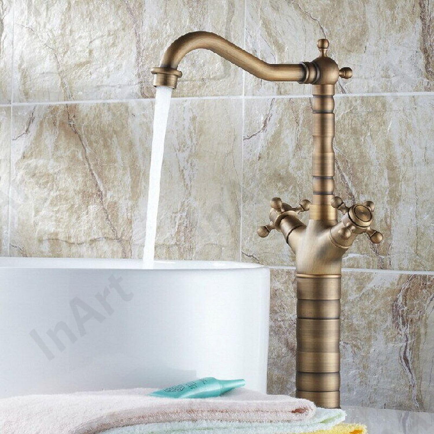 Close-up of InArt deck mounted basin mixer tap showing lever handle and premium brass antique oil rubbed finish