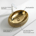 Designer golden wash basin, oval ceramic table top basin shown at 3/4 angle for washroom