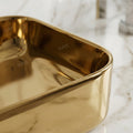 Rectangular table top wash basin counter design in gold, modern bathroom basin with tap hole detail