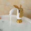 Modern wash basin mixer tap for bathroom in oil-rubbed gold, swan shape single handle, side angle