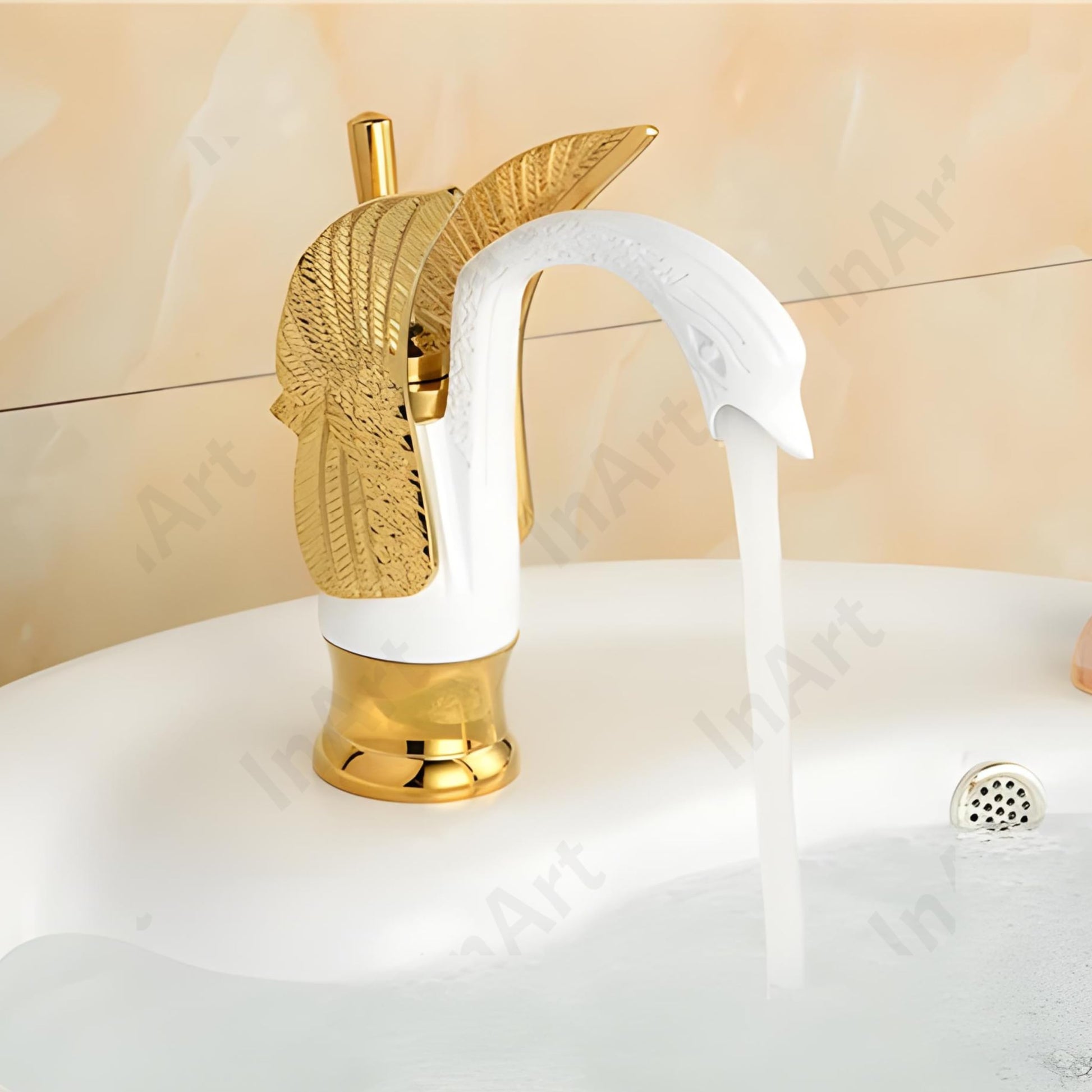 Luxury bathroom fittings gold basin tap by InArt, brass swan neck mixer tap on wash basin in bathroom setting