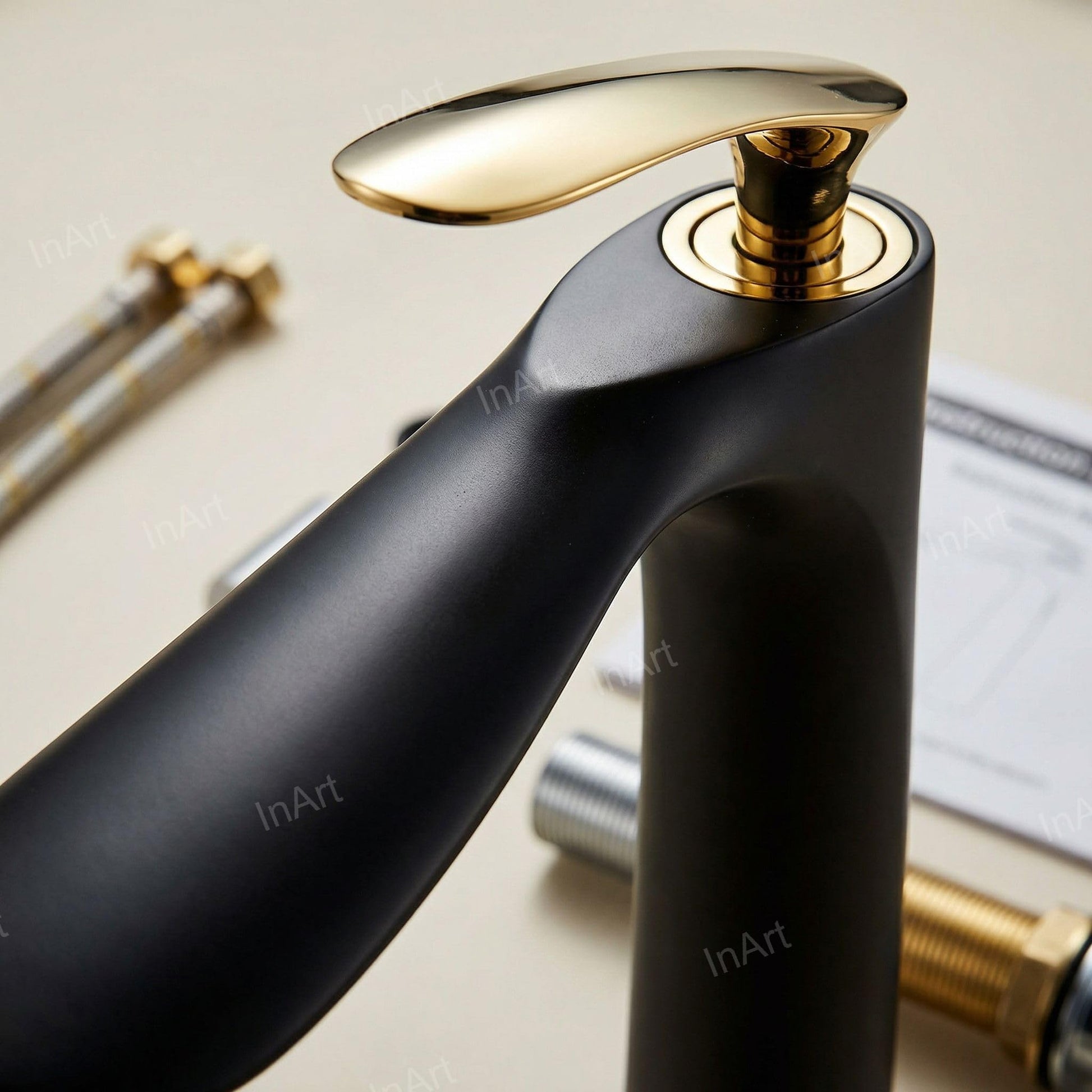 Single hole basin mixer tap in black gold finish, top view highlighting aerator and spout curve