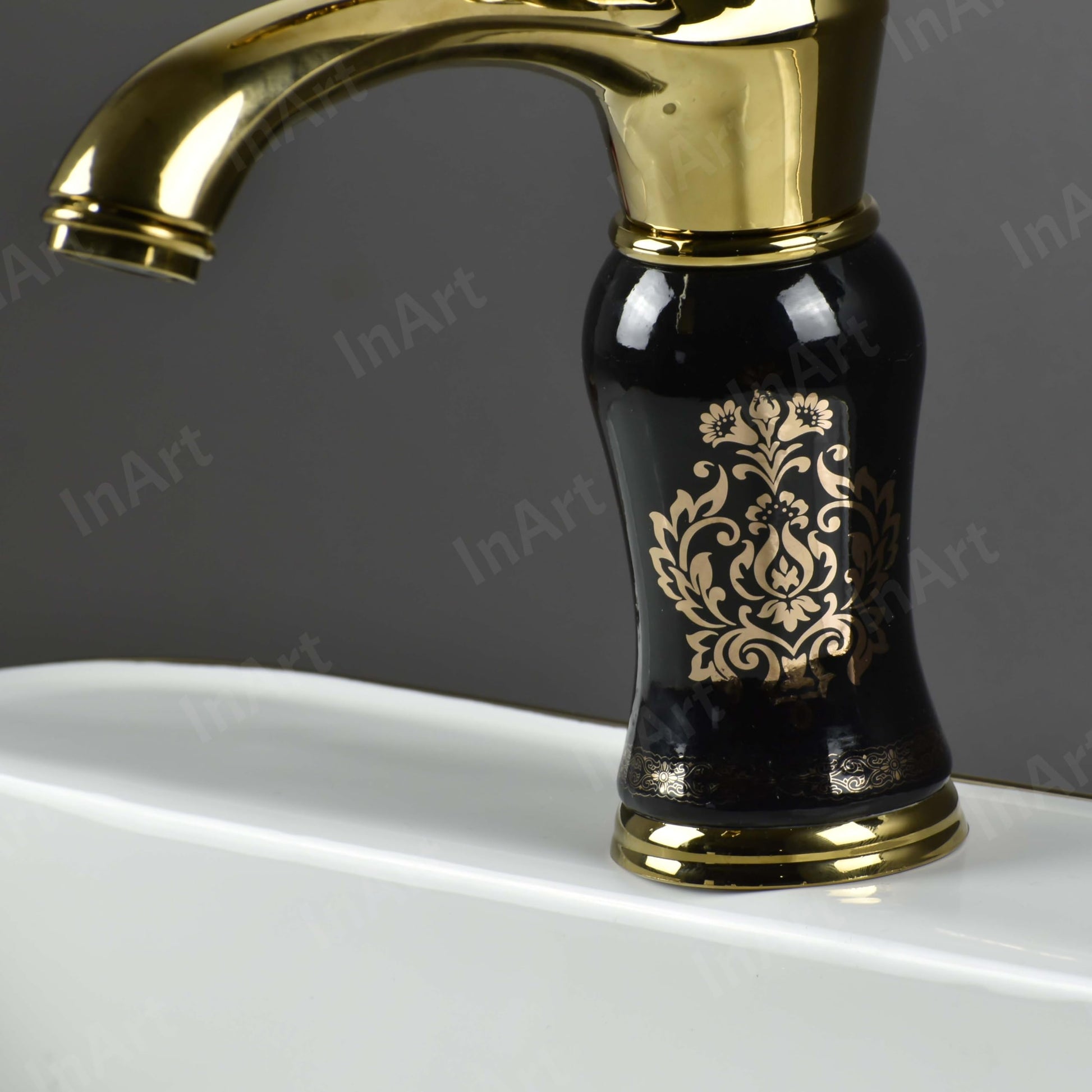 Close-up of InArt ceramic cartridge single lever basin mixer tap, black gold glossy brass body for wash basin