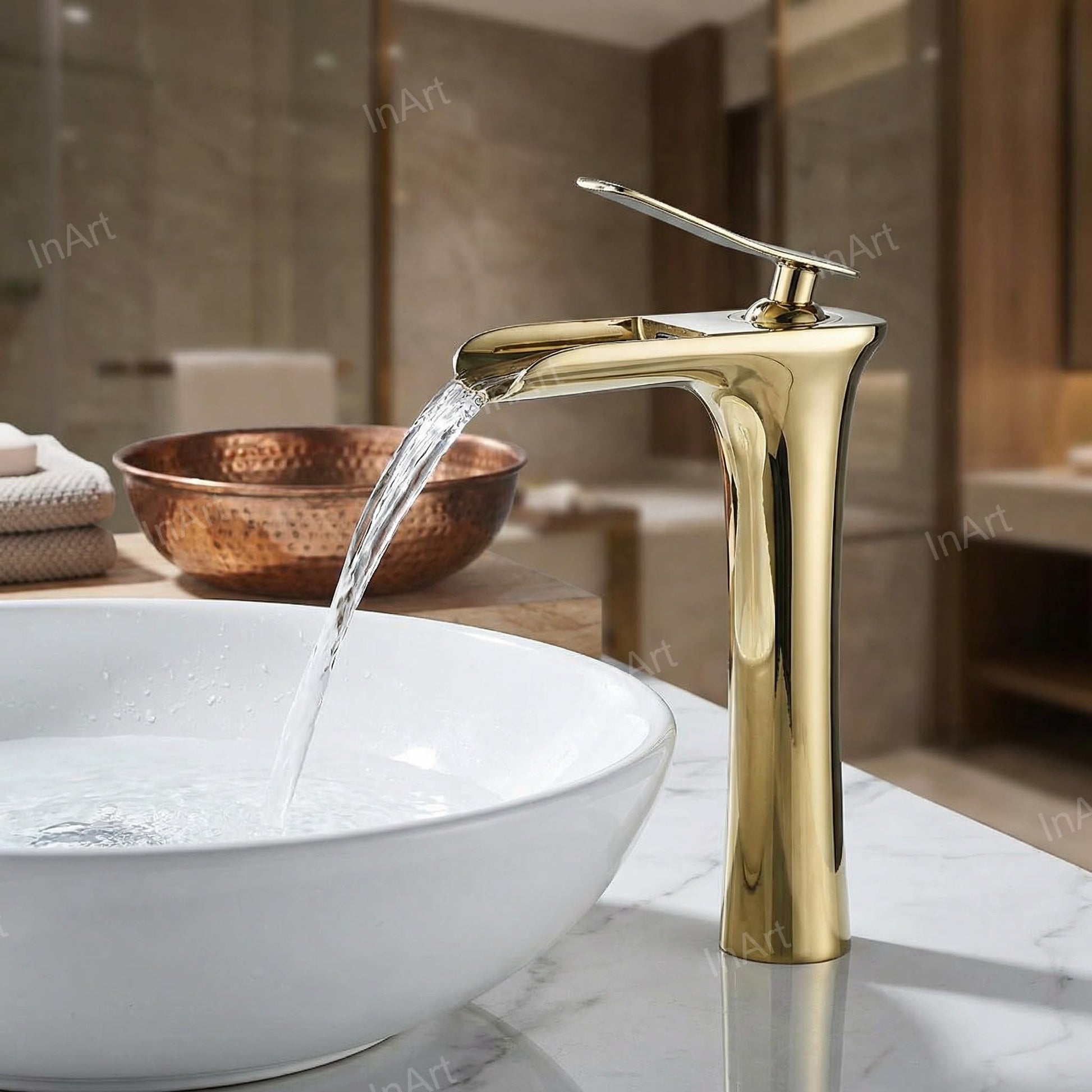 InArt wash basin mixer with hot and cold control, golden brass single lever tap close-up of handle