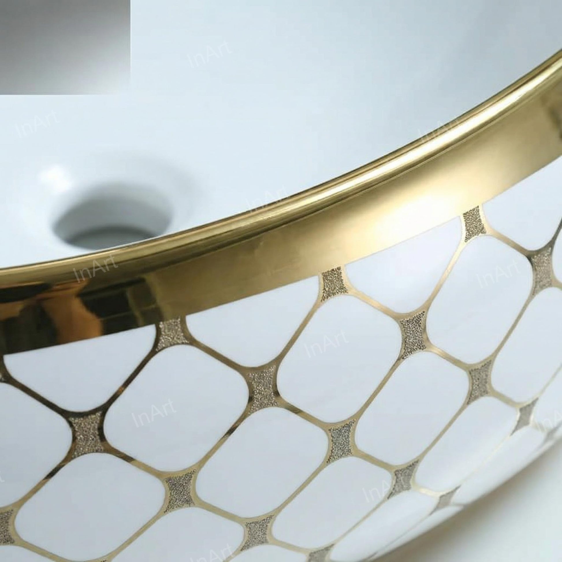 InArt over counter wash basin on bathroom counter, oval table top basin with gold rim and tap setting