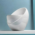 InArt modern single piece western toilet, egg shape ceramic commode in glossy white, side angle view