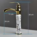 Waterfall basin tap in antique white gold finish, side angle view with single lever hot and cold mixer