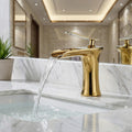InArt brass basin tap with smooth single lever handle, waterfall flow spout detail in golden colour