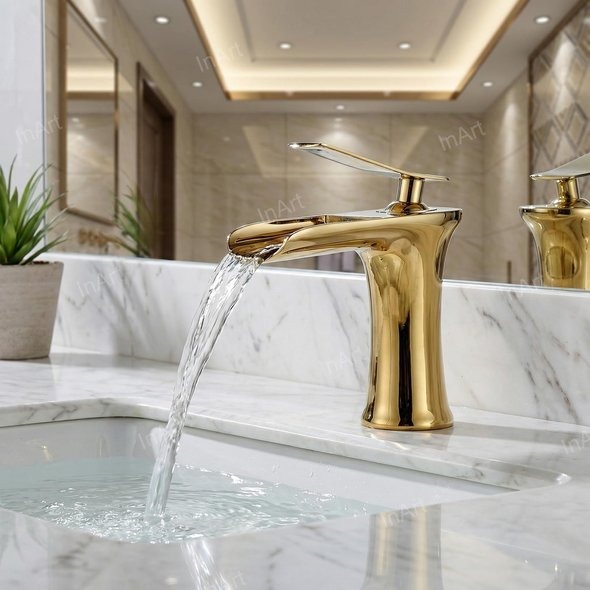 InArt brass basin tap with smooth single lever handle, waterfall flow spout detail in golden colour